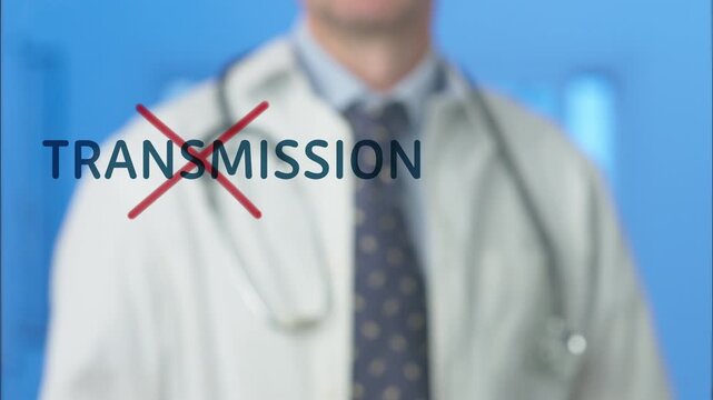 Medical professional crossing out the word transmission with a red marker, symbolizing the prevention of viral infections like ebola and stopping the spread of contagious diseases in a pandemic