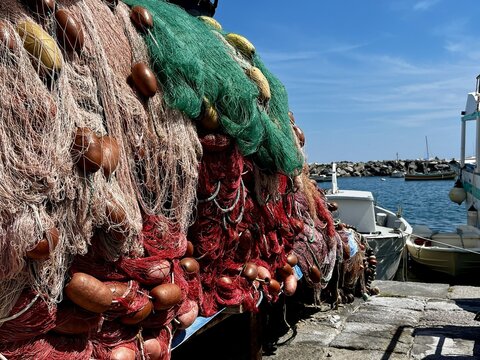 A pile of fishing net on a pier in Procida, Italy