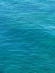 Obraz premium Blue sea water ripples vertical