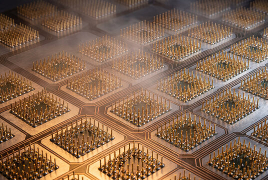 Array of pogo pin test sockets arranged across a high-density electronic circuit board