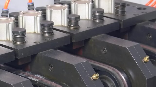 Discover the intricate process of an industrial machine as it expertly shapes copper tube parts for air conditioners. Watch in slow motion the precision and skill involved in each manufacturing step.