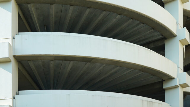 Spiral concrete ramp structure of a multi level parking garage