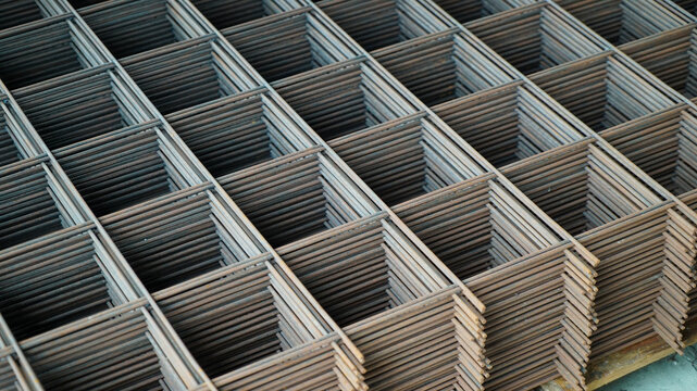 Stacked sheets of welded wire mesh for concrete reinforcement