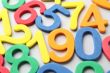 Fototapeta premium Many colorful numbers on grey background, closeup