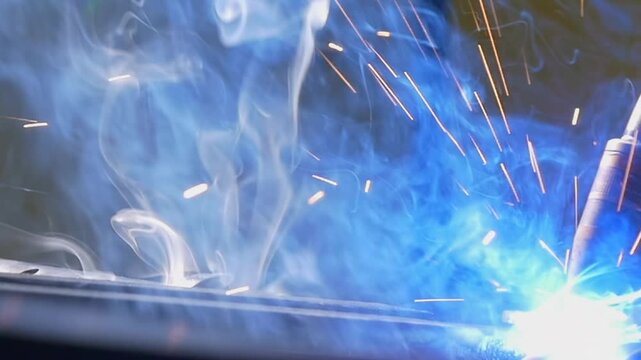 Witness the dazzling sparks and mesmerizing glow as a powerful argon welding robot performs intricate tasks in slow motion. The precision and energy create an awe-inspiring display of technology.