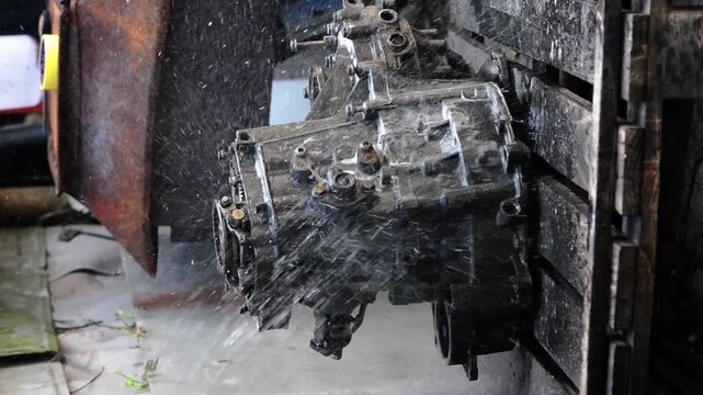 old gear shift box for front-wheel drive car cleaning from dirt with chemical agent and rinsing with water vertical video