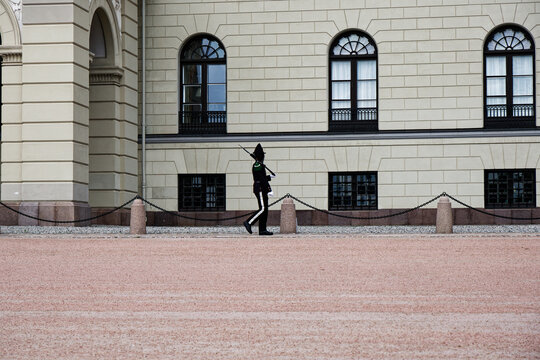 Norwegian Royal Guard Marches Past the Royal Palace in Oslo