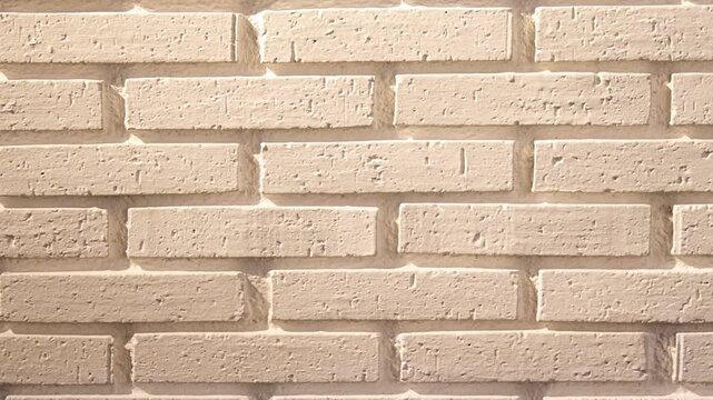 Slow Pan Across Light Cream Brick Wall Texture Background in 4K