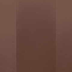 Fototapeta premium Brown textured paper with vertical folds, creating a subtle pattern.