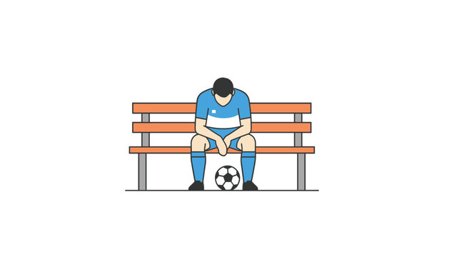 Soccer player wearing a blue and white jersey sitting alone on a bench with head down and a ball near feet looking defeated after a match.