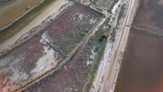 Close aerial view of salt pans on Pag Island capturing textures, colors and geometric patterns of the saltworks