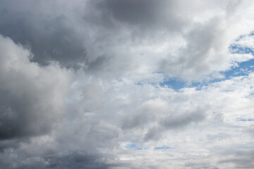Fototapeta premium Dramatic Overcast Sky with Heavy Grey Clouds and Blue Patches