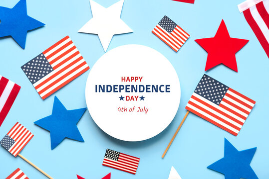 Top view of round blank with the text Happy Independence day 4th of July alongside american flags, stars and american pennants