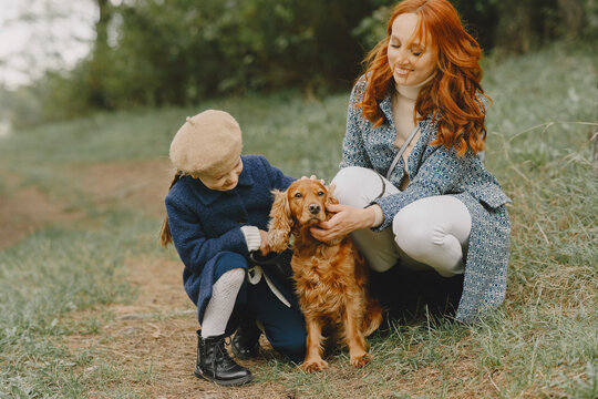 Happy family having fun in autumn forest