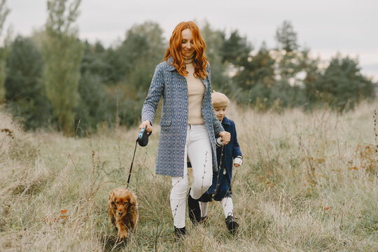 Happy family having fun in autumn forest