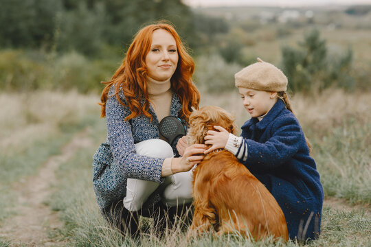 Happy family having fun in autumn forest