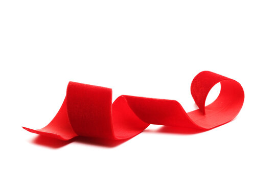 Red soft, plush, velvet ribbon isolated on white background, side view