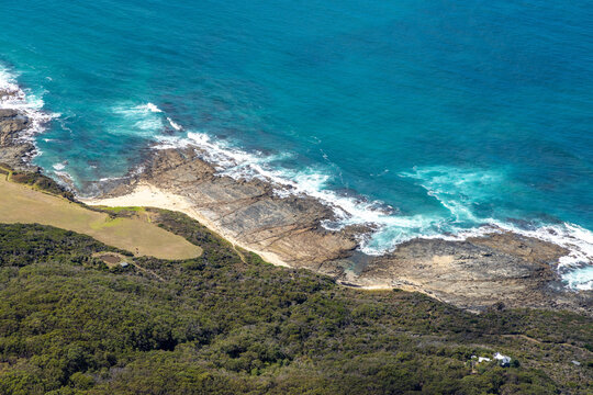 Marengo aerial view of rocky shoreline and sandy beach and coastal vegetation, Victoria Australia