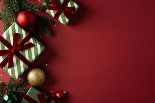 Christmas present and ornaments with Merry Christmas and Happy New Year message on red background