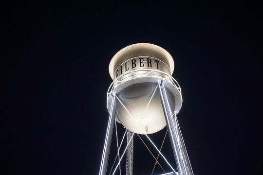 Retro water tower in city of Gilbert Arizona at night