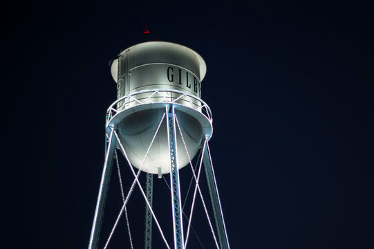 Retro water tower in city of Gilbert Arizona at night