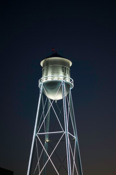 Retro water tower in city of Gilbert Arizona at night