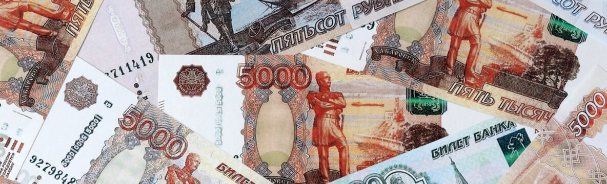 Russian old ruble money bills in pile on table. Russia RUB currency cash close up