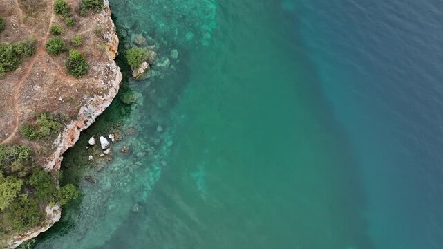 A costline of the Lake Ohrid in North Macedonia. Aerial Drone Shot. Pristine Blue Waters at Cloudy Summer Day in Balkan