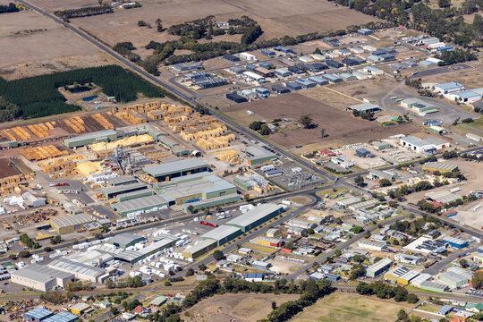 Colac East aerial view of industrial warehouses and timber yard and storage containers, Victoria Australia