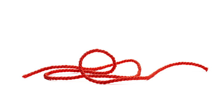 Red string, rope isolated on white background, side view, design element