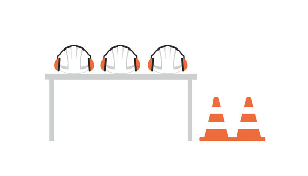 Safety construction equipment including hard hats with ear muffs displayed on table alongside orange traffic cones for work site preparation.