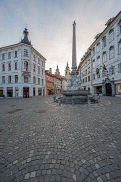 Robba Fountain - Robbov Vodnjak - in Town Square in central Ljubljana, Slovenia in early morning summer light with Ljubljana Cathedral in background.
