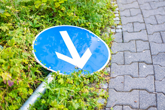 Fallen traffic sign, poor decisions urban planning and personal choices, failed guidance, miscommunication, wrong turn in life, career change, being off track from goals, course correction, new path