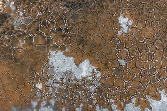 Aerial view of the intricate cracked patterns of the salt flats in La Ventana, Baja California Sur, Mexico.