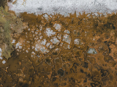 Aerial view of the intricate cracked patterns and textures of the dry salt flats in La Ventana, Baja California Sur, Mexico.