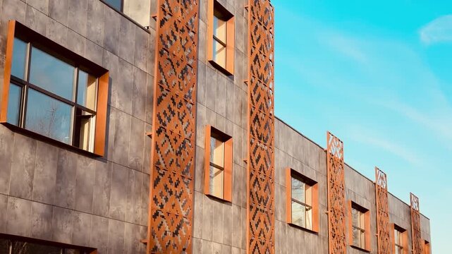 Industrial facade with rusty cladding and patterned metal stripes, raw concrete walls, large storefront windows, dusty