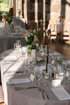 Long Reception Banquet Table with Botanical Floral Decor Glassware and Elegant Linen Styling in Luxury Wedding Venue