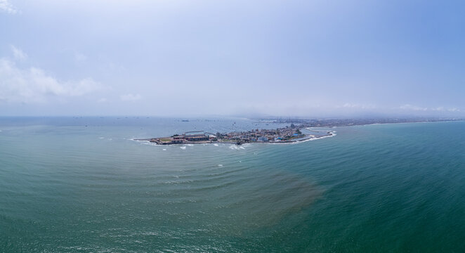 Aerial view of the coastal peninsula of La Punta, featuring residential buildings, sandy beaches, and the surrounding Pacific Ocean in La Punta, Callao Region, Peru.