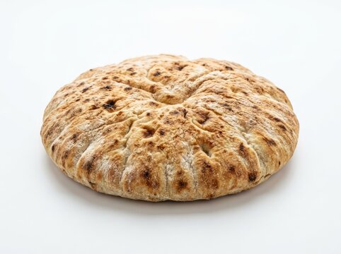 A freshly baked pita bread with a slightly puffed-up center and golden-brown crust, isolated on a clean white surface. The texture of the bread is rustic and inviting, showcasing its delicious nature