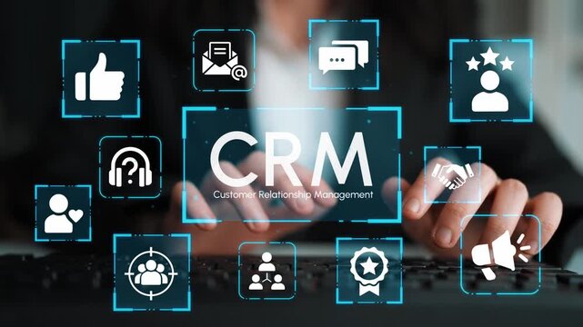 Hands Typing on Keyboard Surrounded by Icons Representing Customer Relationship Management Technology and Communication Tools in a Modern Office Setting. Entropy.