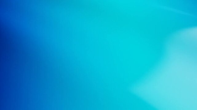 Abstract blue gradient background with soft light waves