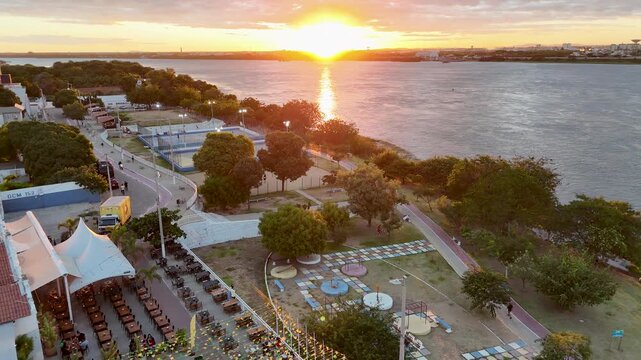 Juazeiro Skyline In Juazeiro Bahia Brazil. Tropical River With A Scenic Forest Trees Viewed From Above. Sunset Sky Clouds Downtown Cityscape. Sunset Outdoors Panning Wide. Juazeiro Bahia.
