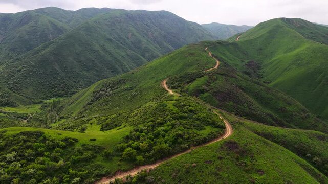 Mountainous area with different vegetation. Daylight saving time.