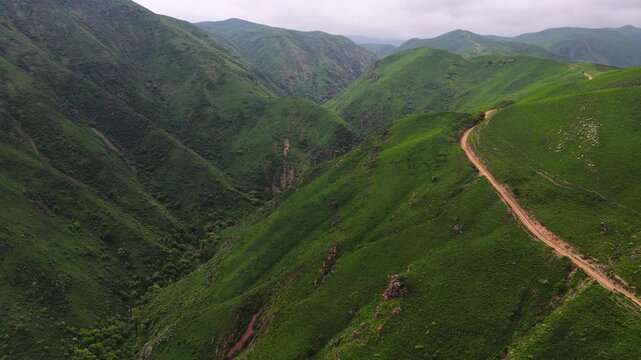 Mountainous area with different vegetation. Daylight saving time.