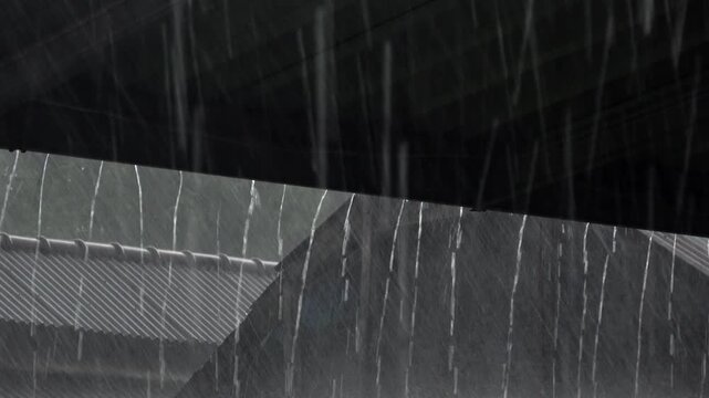 A dark, moody close up shot of intense rain streaming down a transparent corrugated canopy roof during a severe nighttime tropical thunderstorm.

