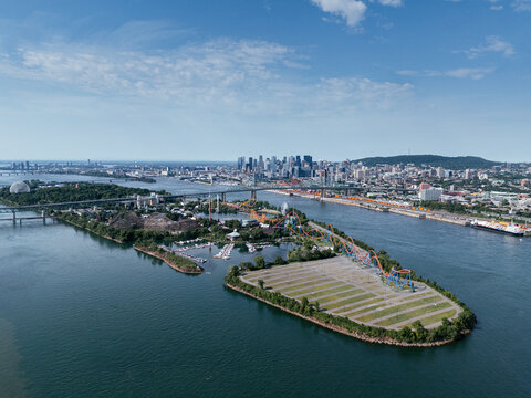 Aerial view of Montreal skyline, Jacques Cartier Bridge and La Ronde amusement island on St Lawrence River. g.