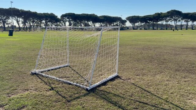 A practice football goal on a football field.