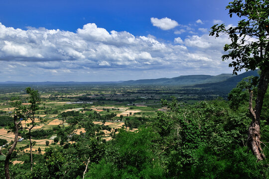 Panoramic aerial landscape view of the Kalasin valley and agricultural fields from a mountain ridge in Thailand.