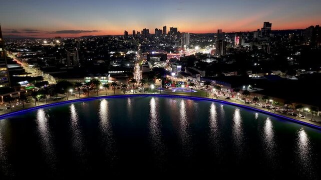 Sunset Campina Grande Skyline In Campina Grande Paraiba Brazil. Aerial View Of Green Space Surrounded By Lush Forest Trees. Building Illumination Urban. Town Exterior Panoramic.