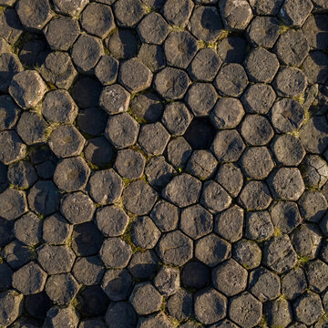 Perfect hexagonal basalt columns tightly packed together forming a natural stone floor pattern